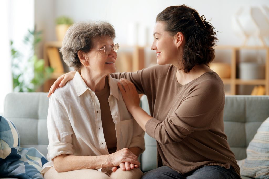 Woman supporting an older adult with long term care needs at home