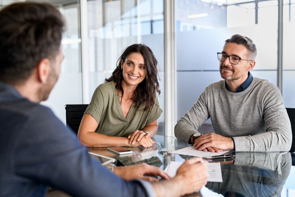 Couple learning how annuities pay out with guidance from a financial professional.